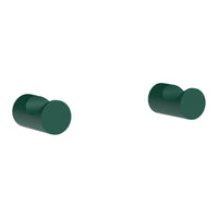 Green cylindrical knobs with a smooth finish, ideal for modern home decor and furniture enhancement.