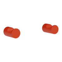 Bright red cylindrical knobs with a smooth finish, perfect for modern decor.