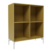 Modern yellow bookshelf with four open compartments and sleek silver legs. Perfect for stylish storage solutions.