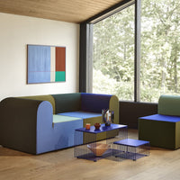 Contemporary sofa featuring bold blue, green, and purple colors with a modern geometric design.