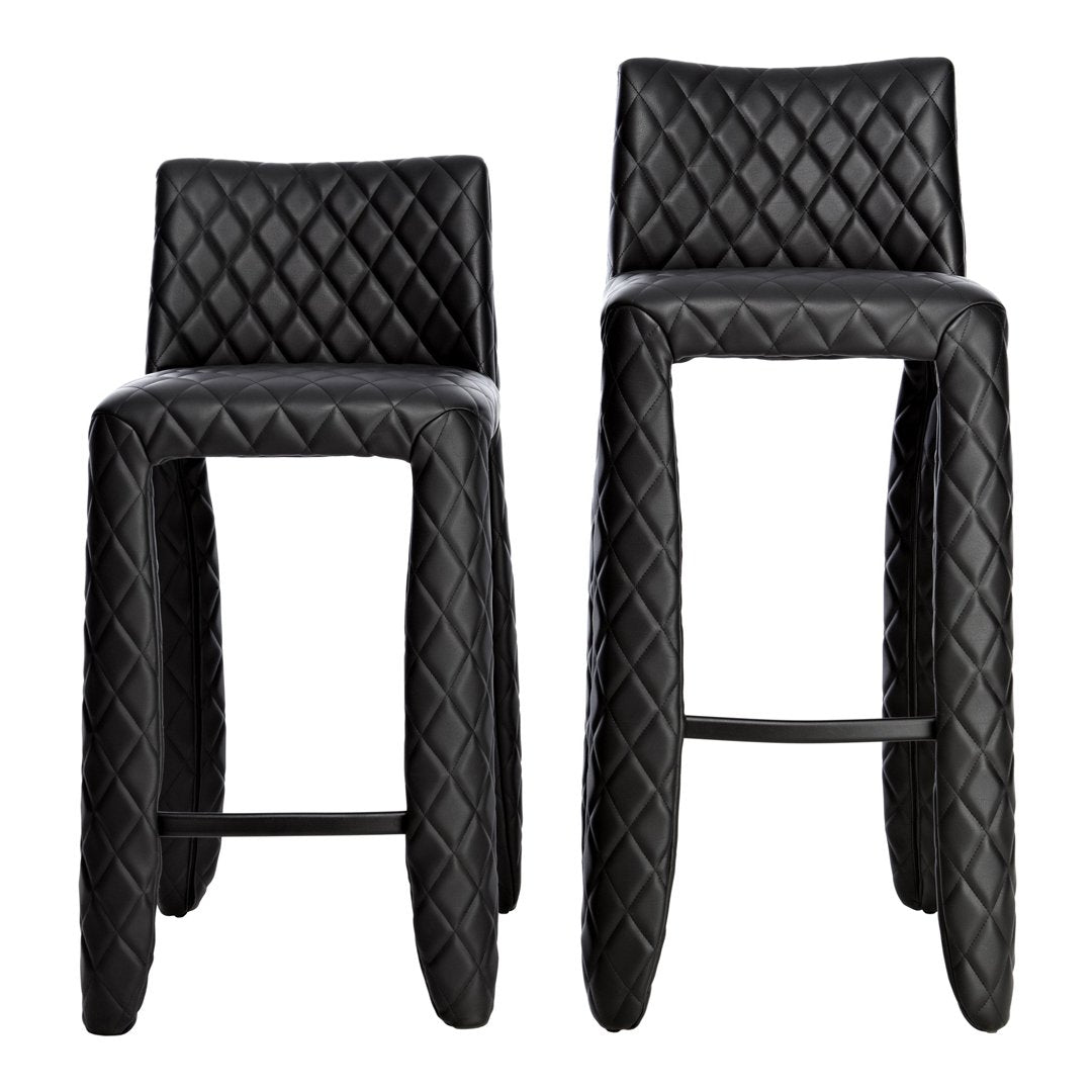 Black bar stools with a diamond quilted pattern and sleek, modern design. Perfect for contemporary decor.