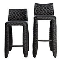 Black bar stools with a diamond quilted pattern and sleek, modern design. Perfect for contemporary decor.