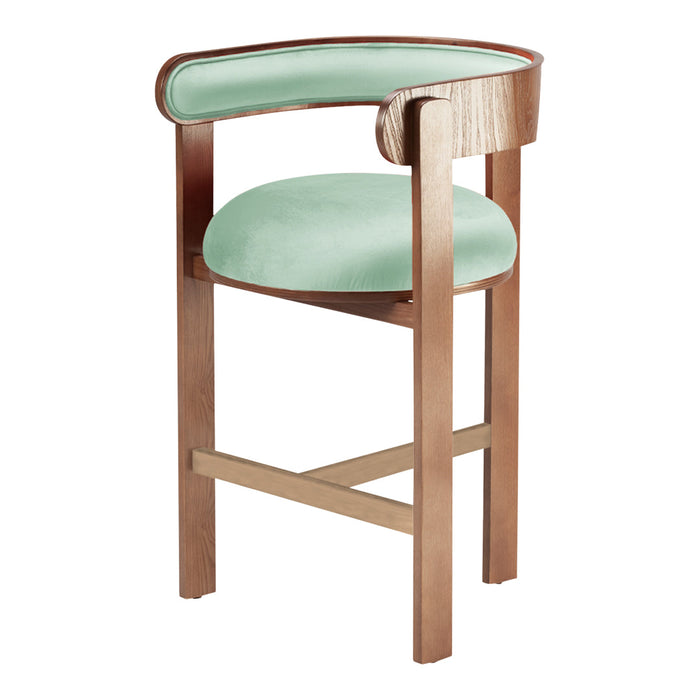 Mint green velvet seat with a warm wooden frame, showcasing a modern and elegant design.