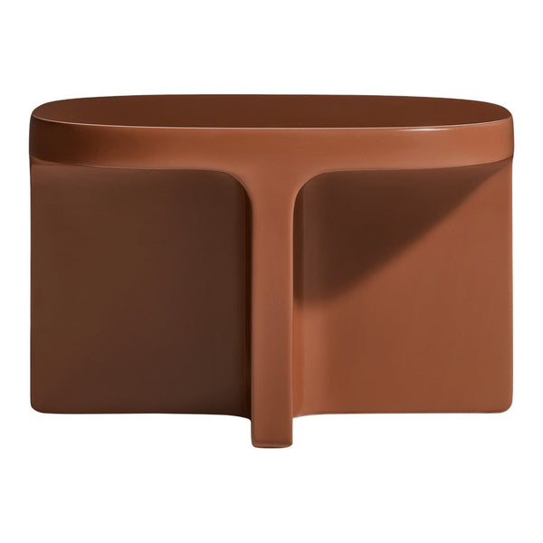 Terra cotta-colored stool with a smooth, minimalist design and subtle organic shapes. Perfect for modern decor.