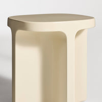 Beige minimalist stool with smooth, rounded edges and a modern design, perfect for contemporary decor.