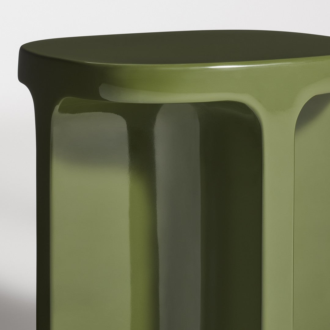 Glossy olive green table with smooth, curved edges and a modern design.