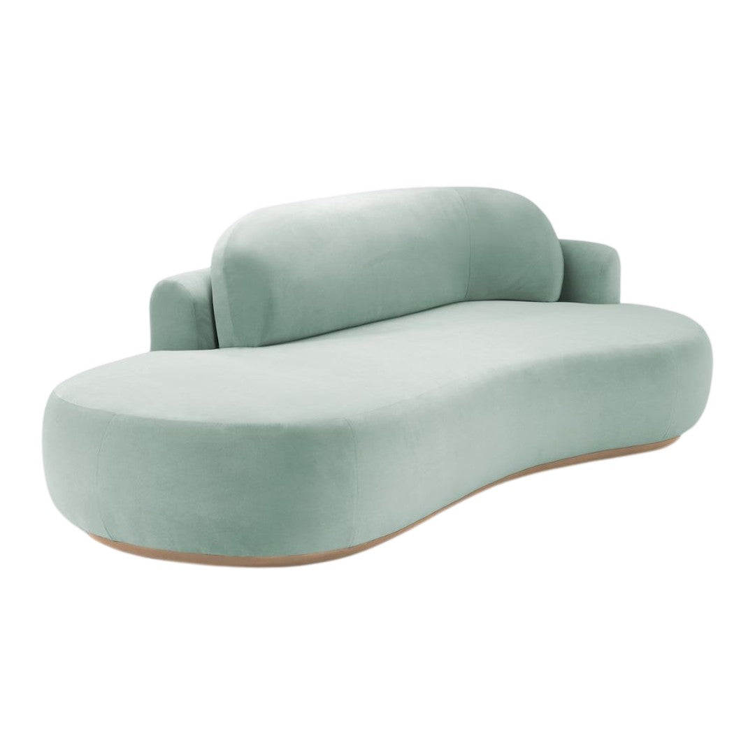 Soft green curved sofa with a smooth, velvety finish and minimalist, contemporary design. Perfect for modern interiors.