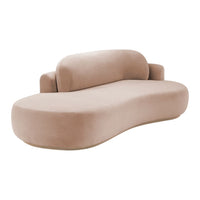 Beige curved sofa with smooth, plush textured fabric and organic, modern silhouette. Perfect for contemporary decor.