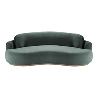 Curved sofa in deep teal fabric with a smooth, minimalist design. Elegant and modern for any living space.