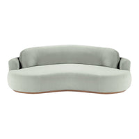 Curved light gray sofa with smooth fabric and a minimalist design featuring a subtle wood base.