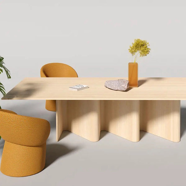 Stylish wooden table with beige finish, accented by mustard yellow chairs and a minimalist vase. Modern design elements.