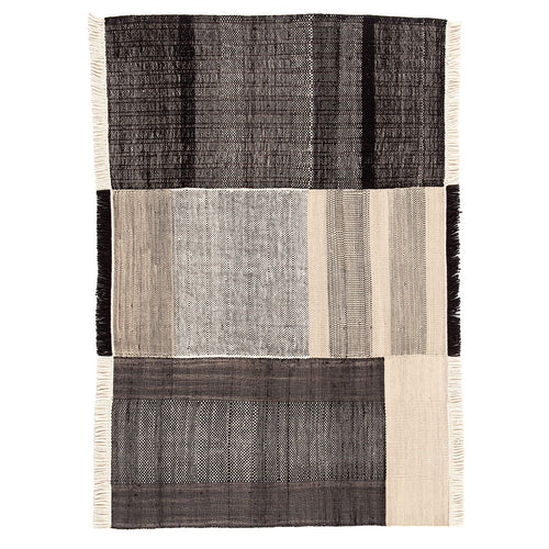 Textured area rug featuring a modern design in shades of black, gray, and beige with subtle woven patterns.