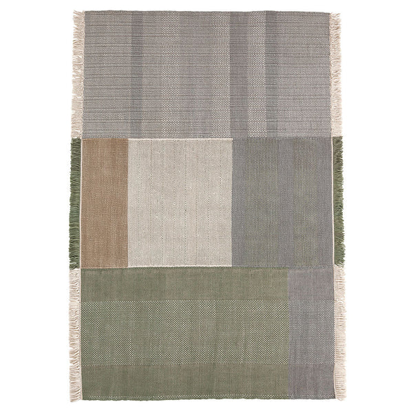 Textured area rug featuring muted gray, beige, and green panels with subtle patterns and fringe detailing.