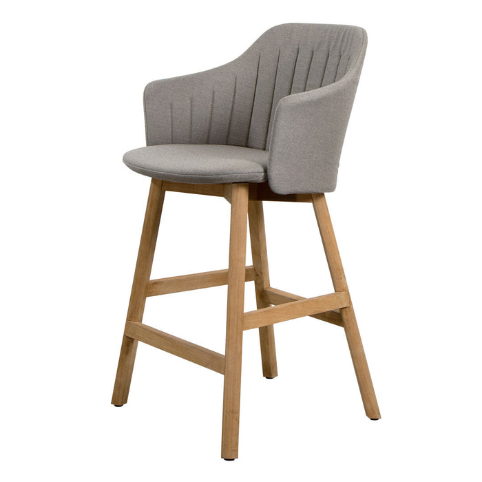 Gray upholstered bar chair with subtle vertical quilted pattern and natural wood legs. Modern and stylish design.