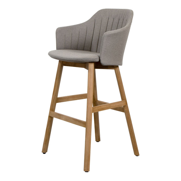 Gray upholstered bar stool with vertical ribbed pattern and natural wooden legs for a modern touch.