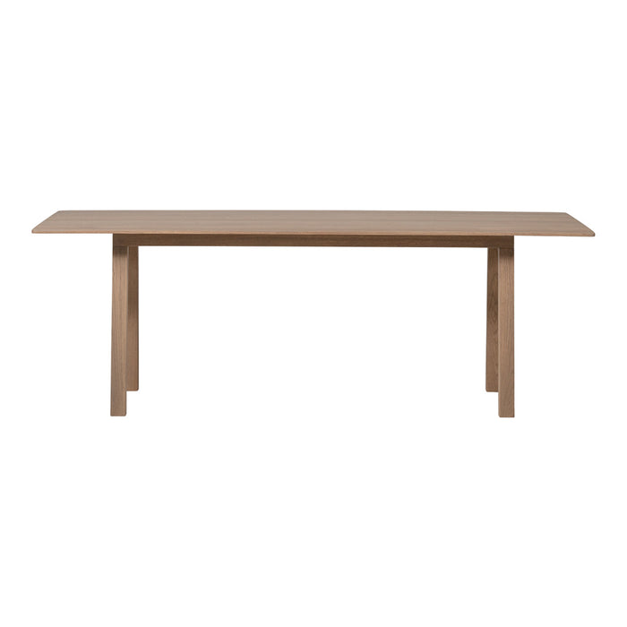 Wooden dining table in a warm beige finish with a simple, modern design and clean lines. Perfect for any decor.