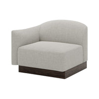 Light gray upholstered chair with a modern curved design and dark wood base. Ideal for contemporary living spaces.