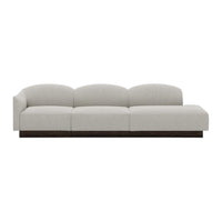 Light gray, plush sofa with smooth, curved lines and a dark wood base, ideal for modern interiors.