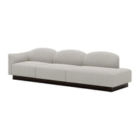 Light gray curved sofa with a smooth fabric texture and dark wood base, perfect for modern living spaces.