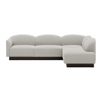 Light gray upholstered sectional sofa with smooth, rounded edges and a dark wood base. Modern minimalist design.