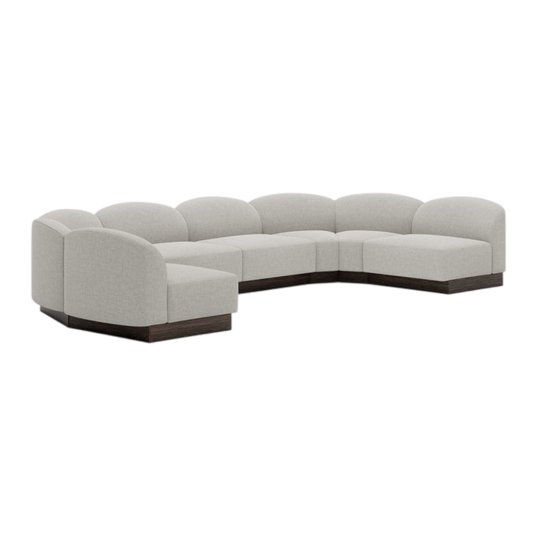 Light gray sectional sofa with smooth, curved edges and a rich, dark wood base. Perfect for modern living spaces.