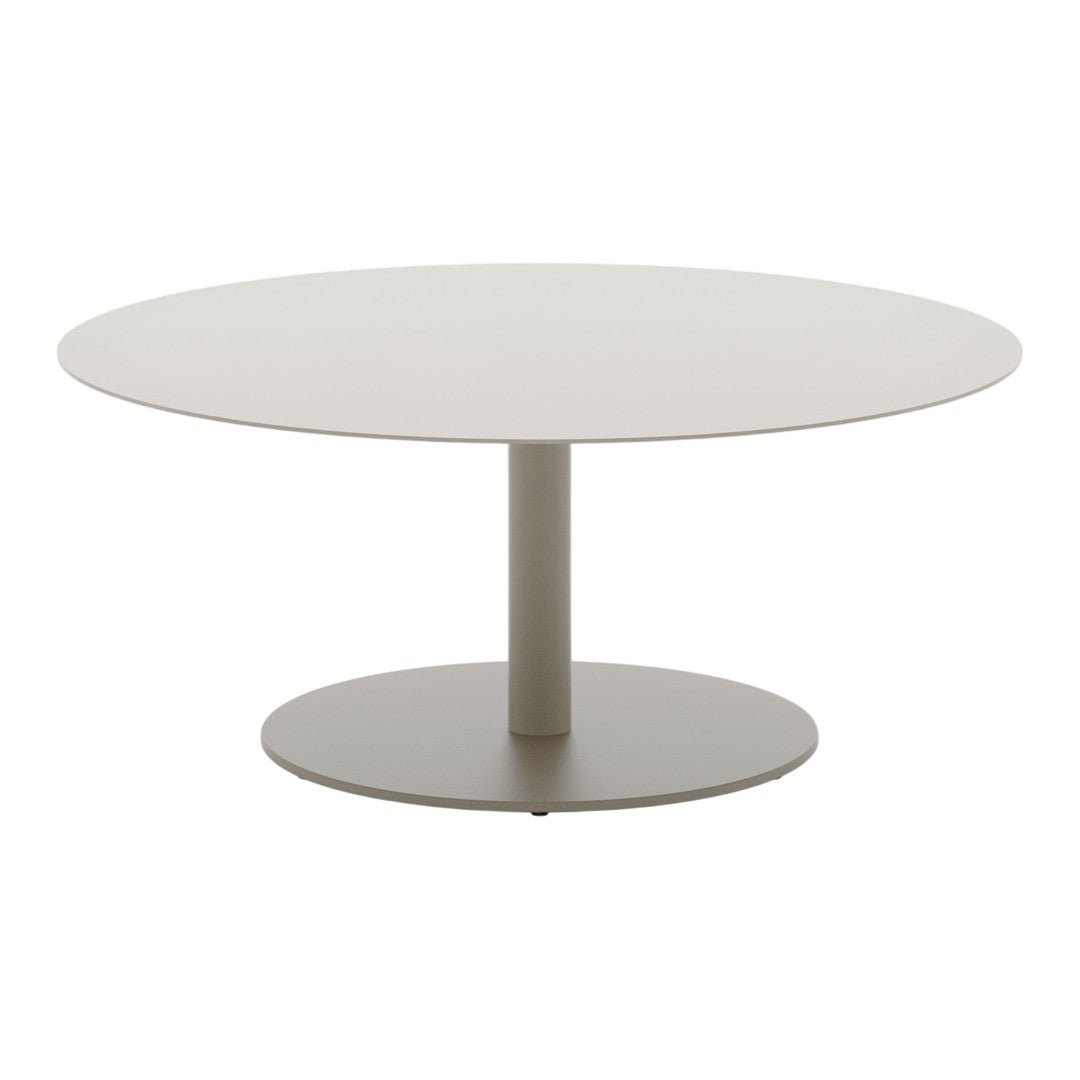 Round modern table in soft beige with a smooth finish and sleek, minimalistic design. Perfect for contemporary spaces.