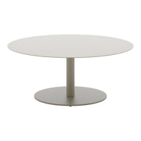 Round modern table in soft beige with a smooth finish and sleek, minimalistic design. Perfect for contemporary spaces.