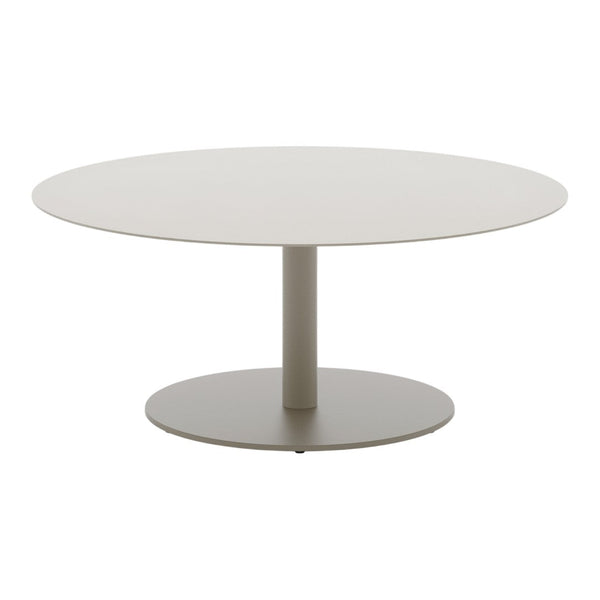 Round modern table in soft beige with a smooth finish and sleek, minimalistic design. Perfect for contemporary spaces.
