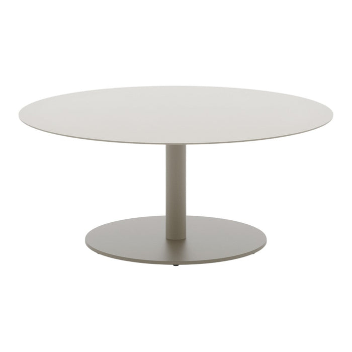 Round modern table in soft beige with a smooth finish and sleek, minimalistic design. Perfect for contemporary spaces.