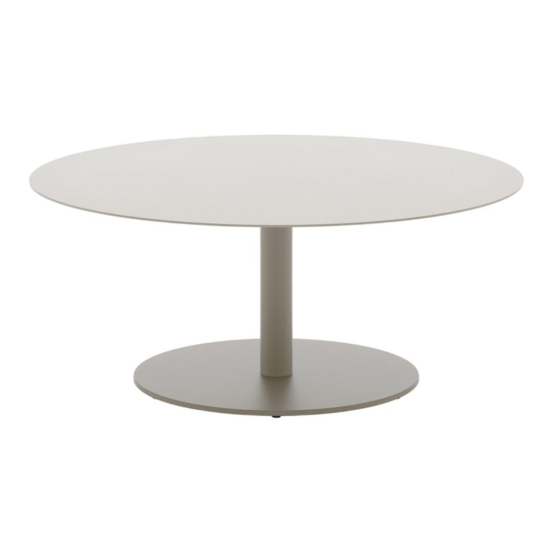 Round modern table in soft beige with a smooth finish and sleek, minimalistic design. Perfect for contemporary spaces.
