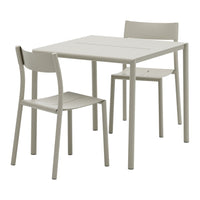 Light grey dining table and two matching chairs with a minimalist design and smooth, solid surfaces.