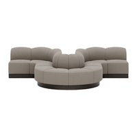 Modern curved sectional sofa in light taupe upholstery with subtle texture and dark wood accents. Perfect for cozy spaces.
