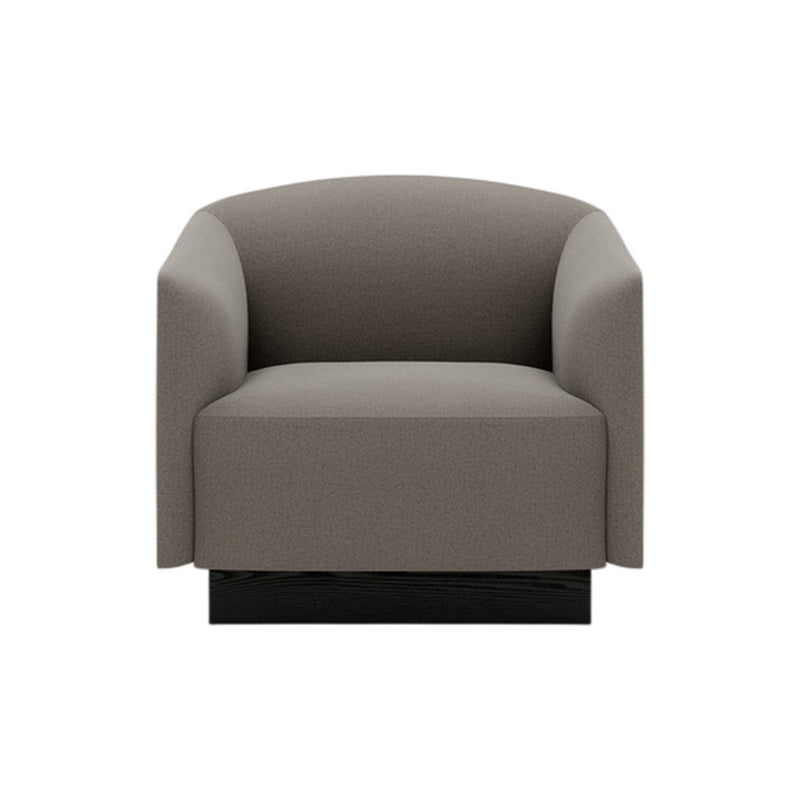 Gray upholstered armchair with a minimalist design and smooth, rounded edges. Black base adds modern touch.