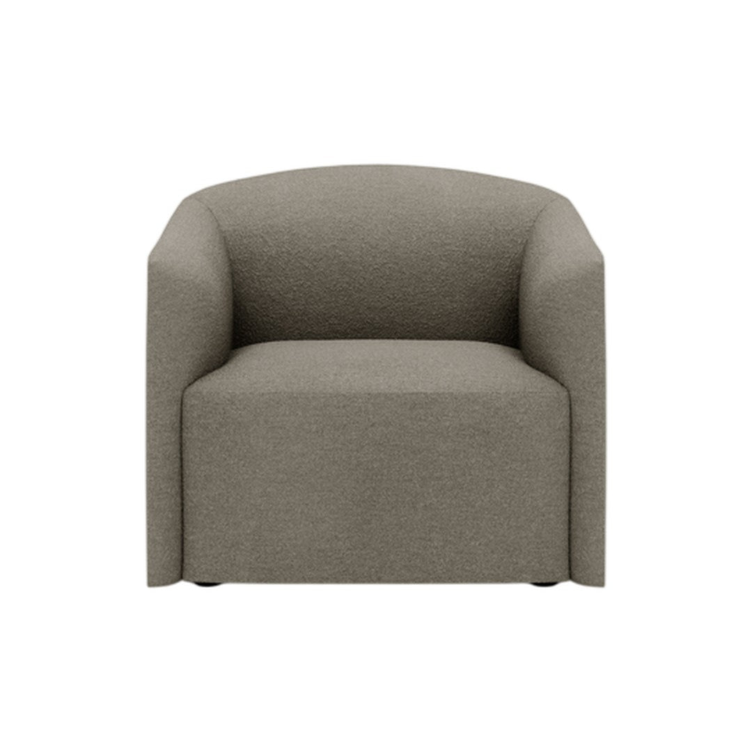 Soft beige armchair with a simple, textured fabric and rounded edges, perfect for modern interiors.
