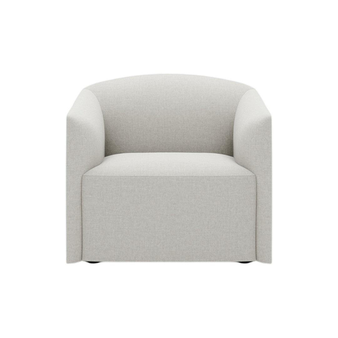 Light gray upholstered armchair with a smooth, minimalist design and curved edges, perfect for modern decor.