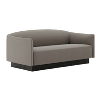 Gray upholstered sofa with a smooth, rounded design and a dark wood base, perfect for modern living spaces.