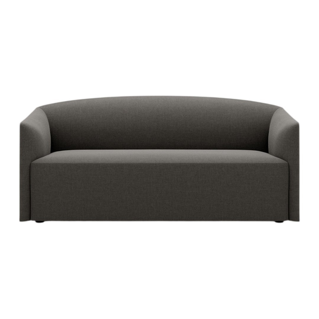 Modern dark gray sofa with a minimalist design and smooth, curved lines. Perfect for contemporary living spaces.