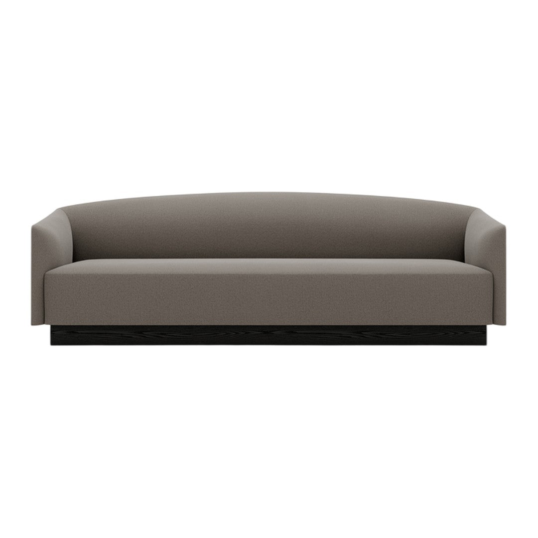 Modern gray sofa with sleek lines and a minimalist design, featuring a solid black base. Perfect for contemporary interiors.