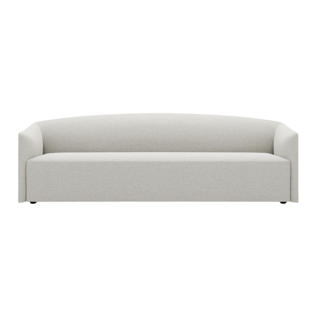 Light gray upholstered sofa with a smooth, minimalist design and rounded backrest. Ideal for modern interiors.