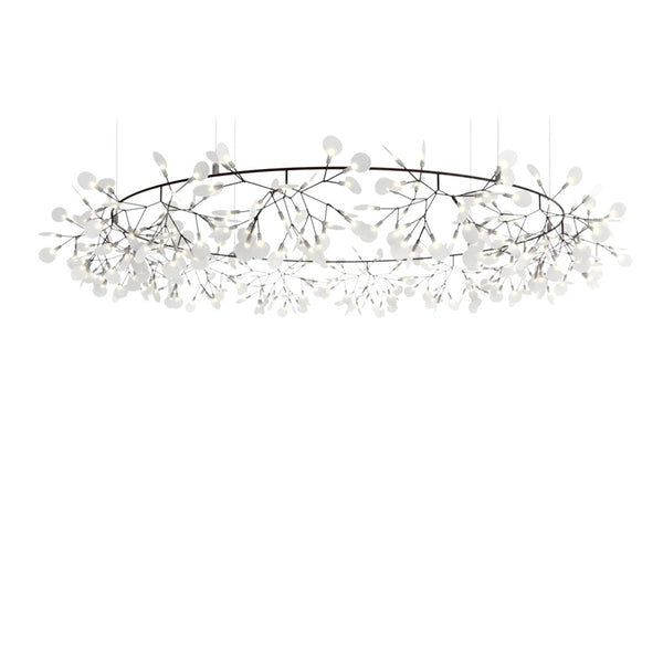 White floral chandelier with delicate branches, featuring an elegant modern design and soft, reflective surfaces.