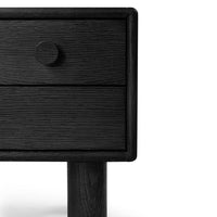 Black wooden nightstand with a textured finish and a minimalist design featuring a round knob.