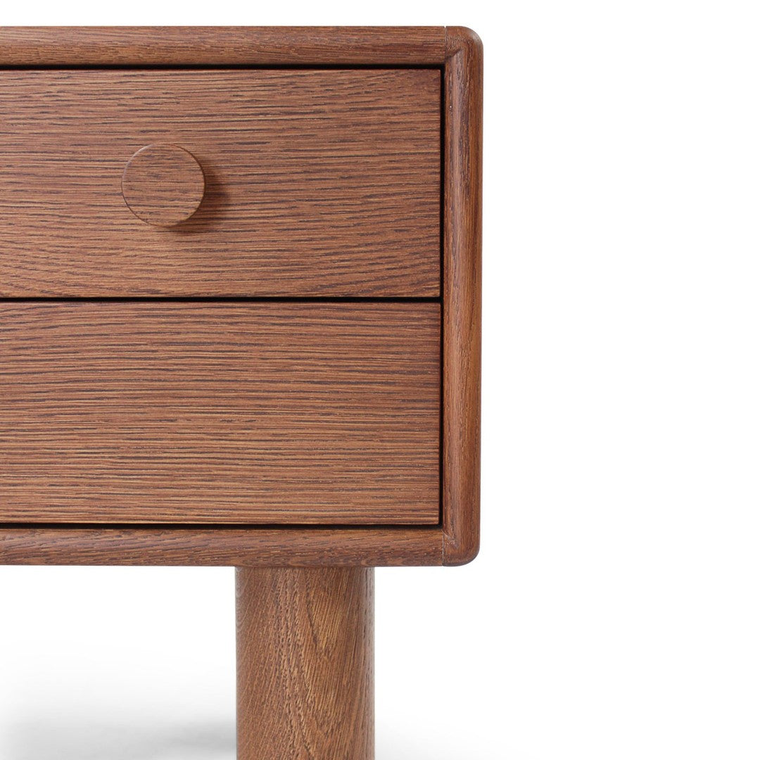 Wooden nightstand with rich brown finish and subtle grain pattern, featuring a round knob and sleek legs.