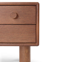 Wooden nightstand with rich brown finish and subtle grain pattern, featuring a round knob and sleek legs.