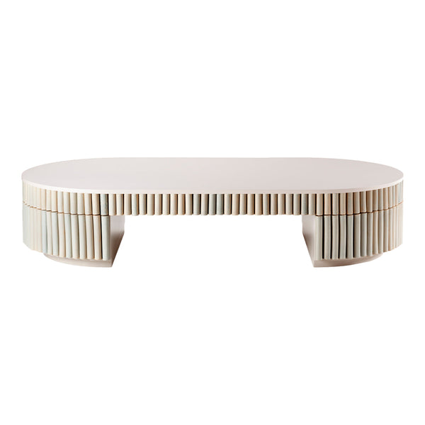 Oval white coffee table with vertical line patterns along the sides, offering a modern and minimalist design.