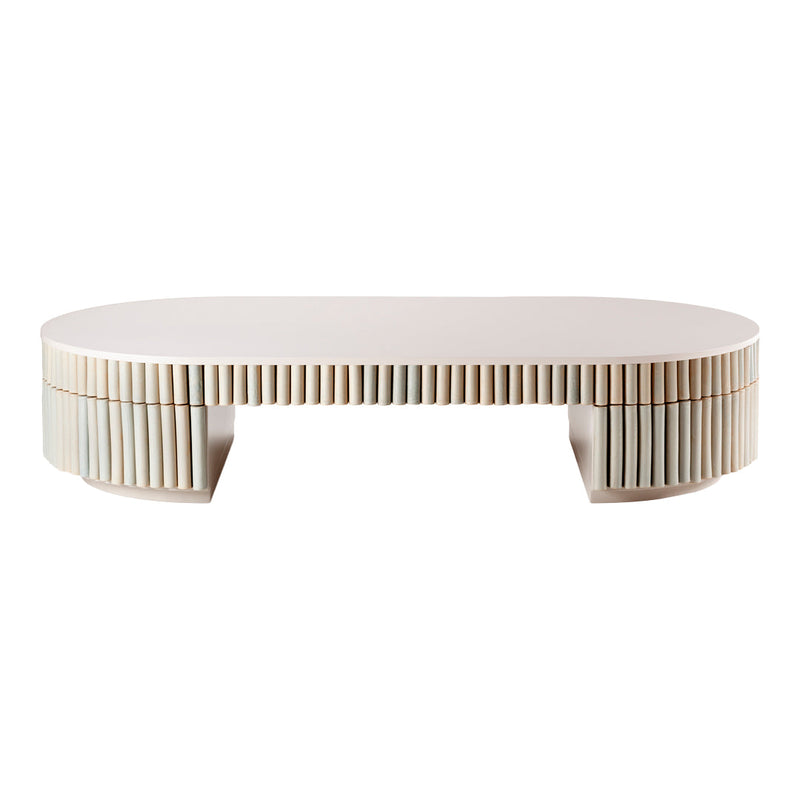 Oval white coffee table with vertical line patterns along the sides, offering a modern and minimalist design.