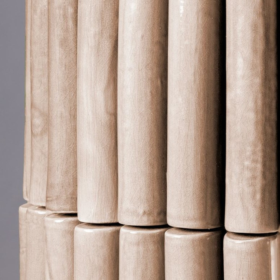 Light beige ceramic rods with a smooth, glossy finish, featuring vertical alignment and subtle natural grain patterns.