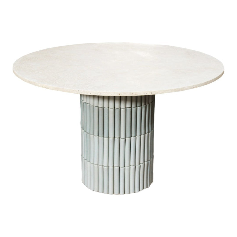 Round table featuring a smooth beige top and a textured light blue cylindrical base. Modern design with striking colors.