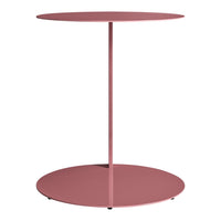 Round side table in soft pink color with a sleek, minimalist design and smooth surface. Ideal for modern decor.