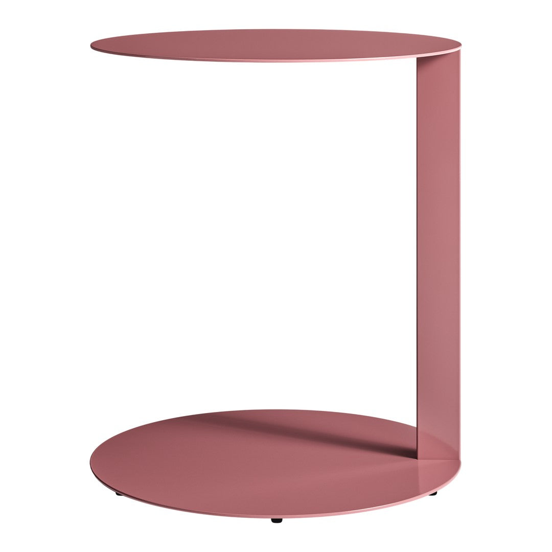 Modern round side table in soft pink with a sleek, minimalist design and smooth finish. Perfect for contemporary decor.