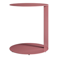 Modern round side table in soft pink with a sleek, minimalist design and smooth finish. Perfect for contemporary decor.